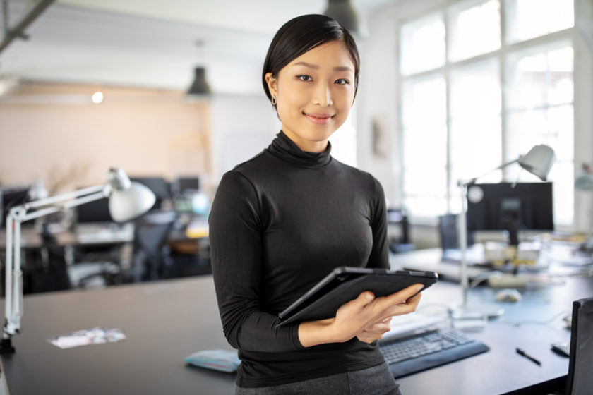 oung businesswoman standing in office