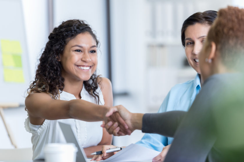 Woman shaking hand.