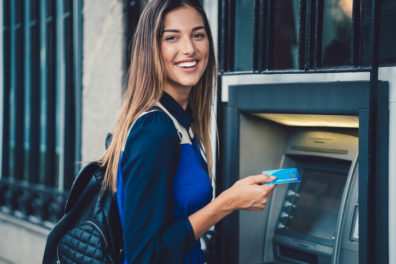 Smiling woman at the ATM