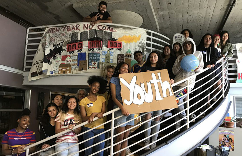 group of children on a spiral staircase with a sign that says youth